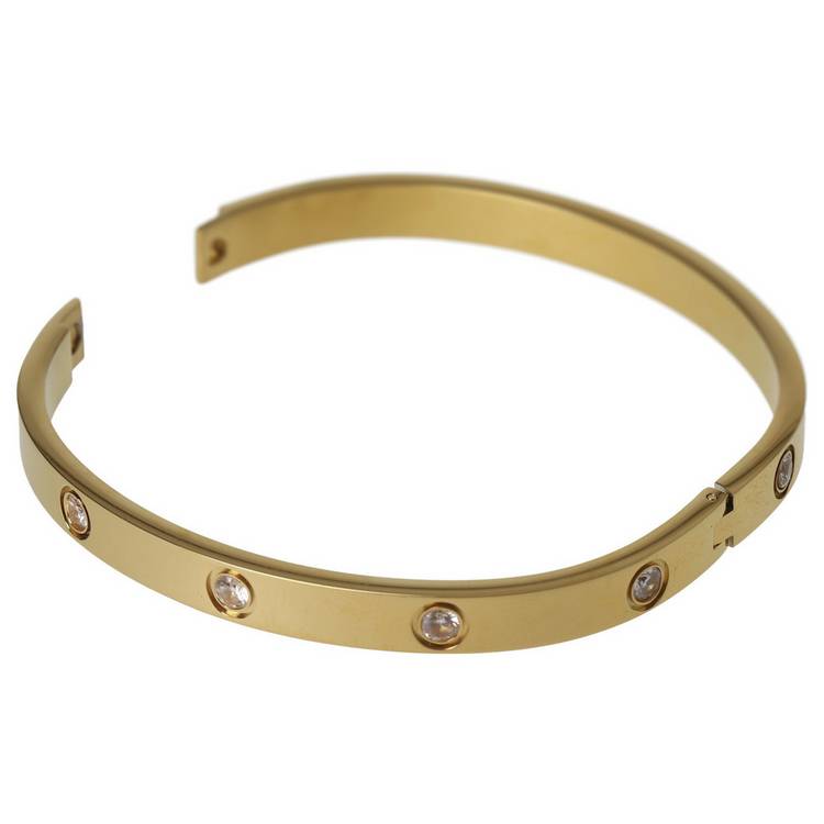 Liars & Lovers gold tone crystal hinged bangle, imported from the UK