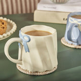 Argos Home scalloped cream mug blue bow 300ml, UK version
