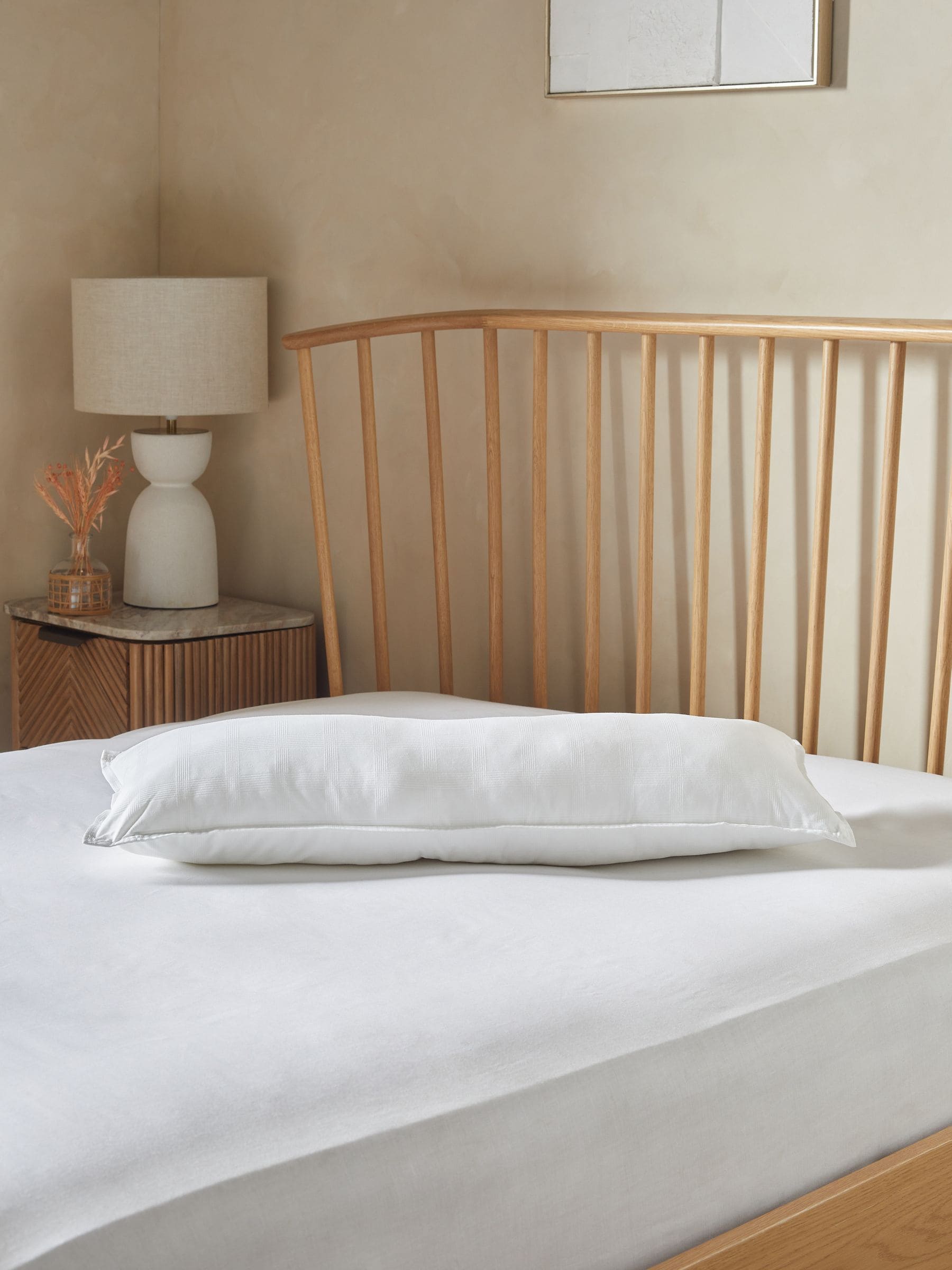 Small bolster feels like down pillow (British brand)