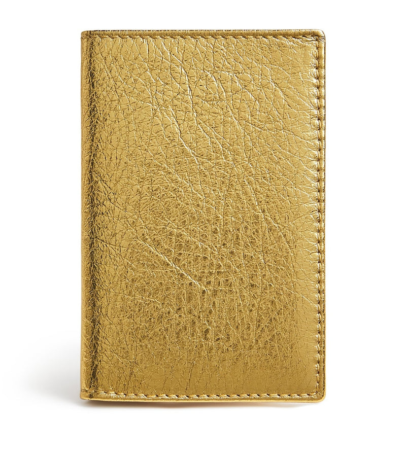 Comme des Garçons vertical card holder with gold metallic accent, imported from the UK