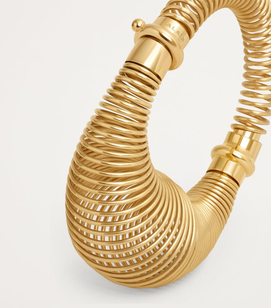 Alaïa gold-tone spiral bracelet stainless steel (British brand)