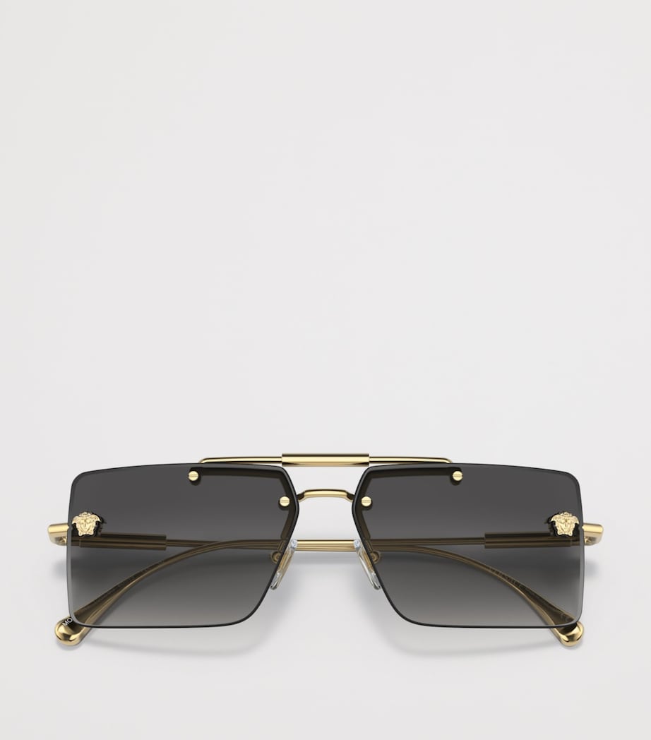 Lunettes de soleil rectangulaires sans monture Versace en métal doré - Produit britannique