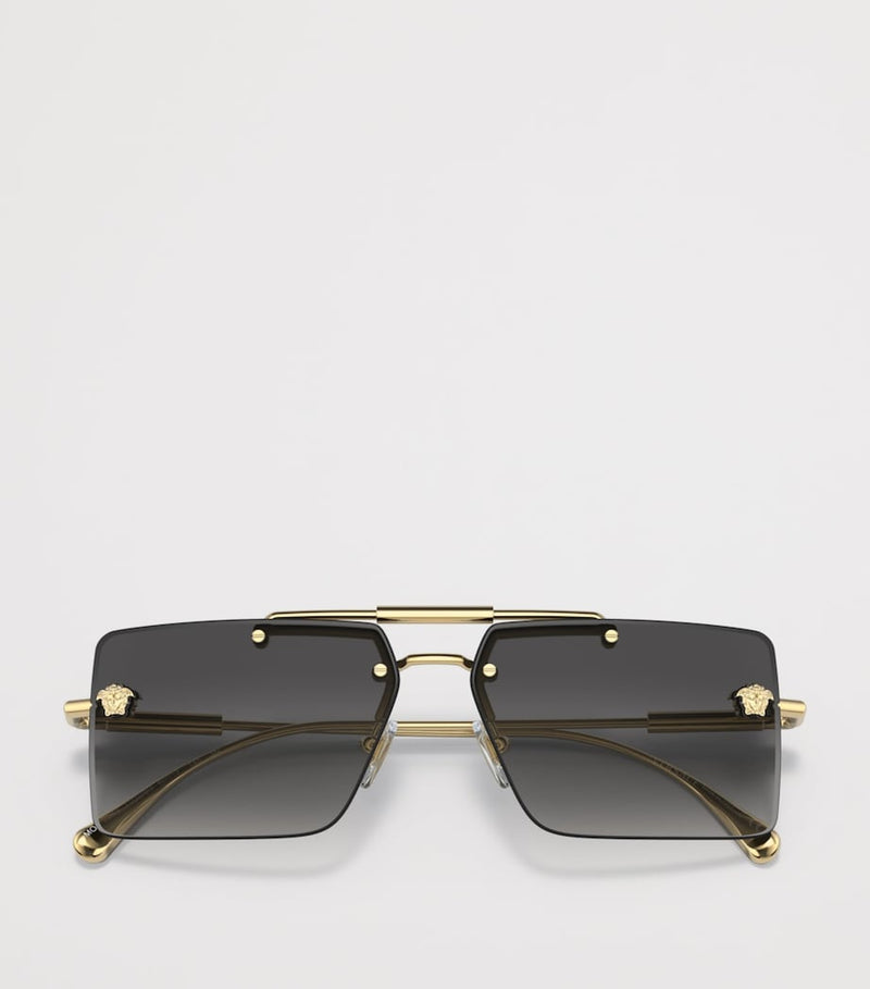 Lunettes de soleil rectangulaires sans monture Versace en métal doré - Produit britannique