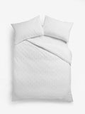 White embossed geometric duvet cover and pillowcase set (British brand)