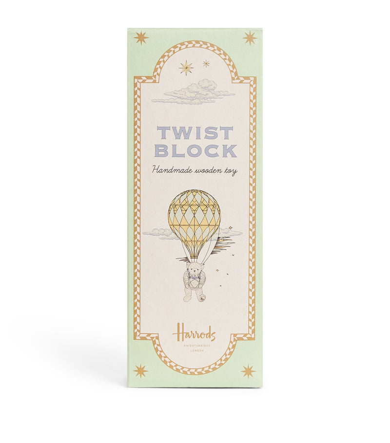 Harrods wooden twist block toy with three illustrated pastel prints, UK version