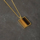 Uncommon Souls gold tone rectangular pendant necklace, imported from the UK