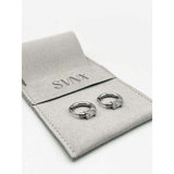SVNX crystal huggie hoops in silver stainless steel (British brand)