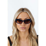 SVNX oval cat-eye sunglasses in navy burg, imported from the UK