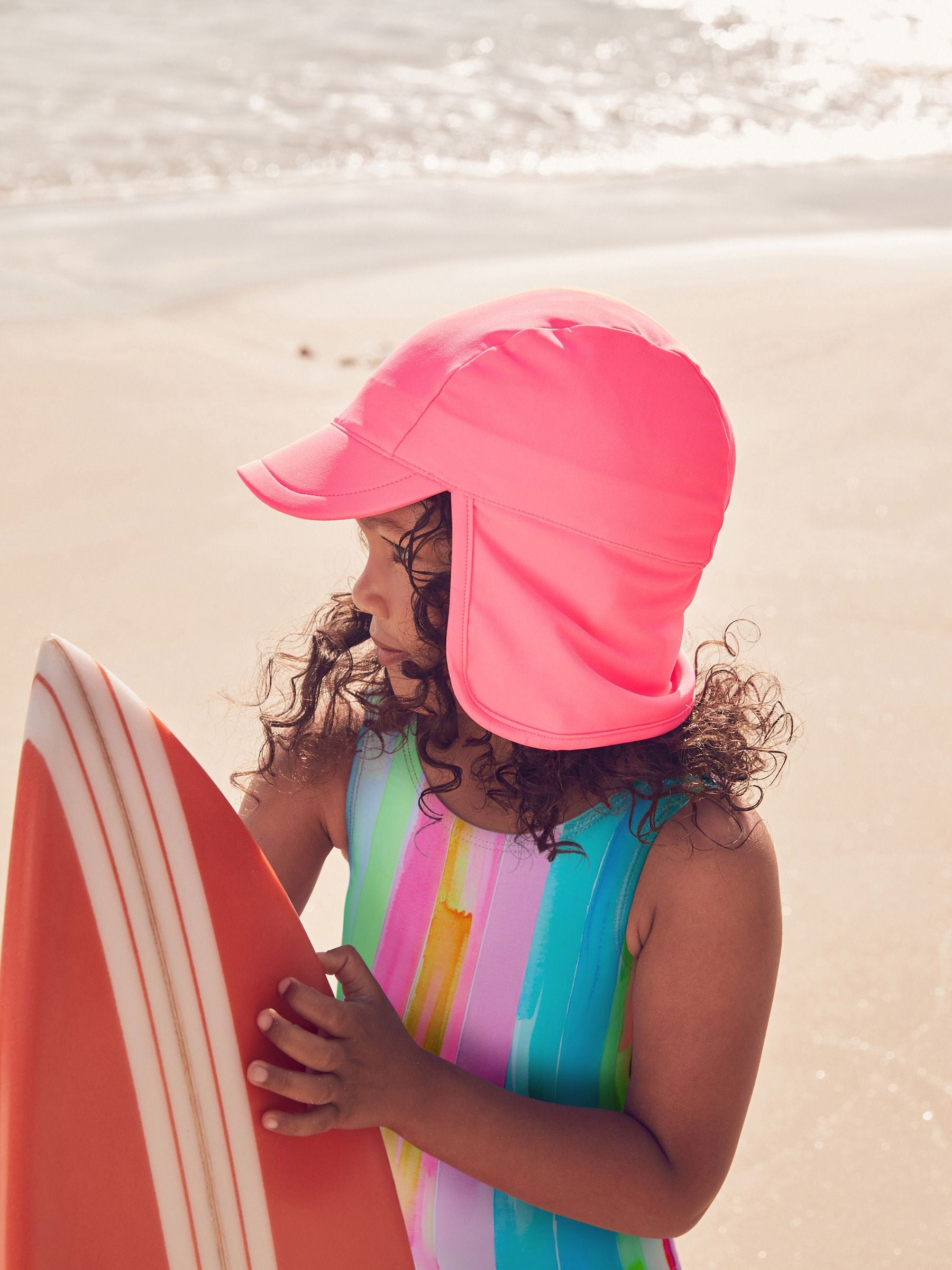 Bright pink legionnaire swim hat for kids, UK version