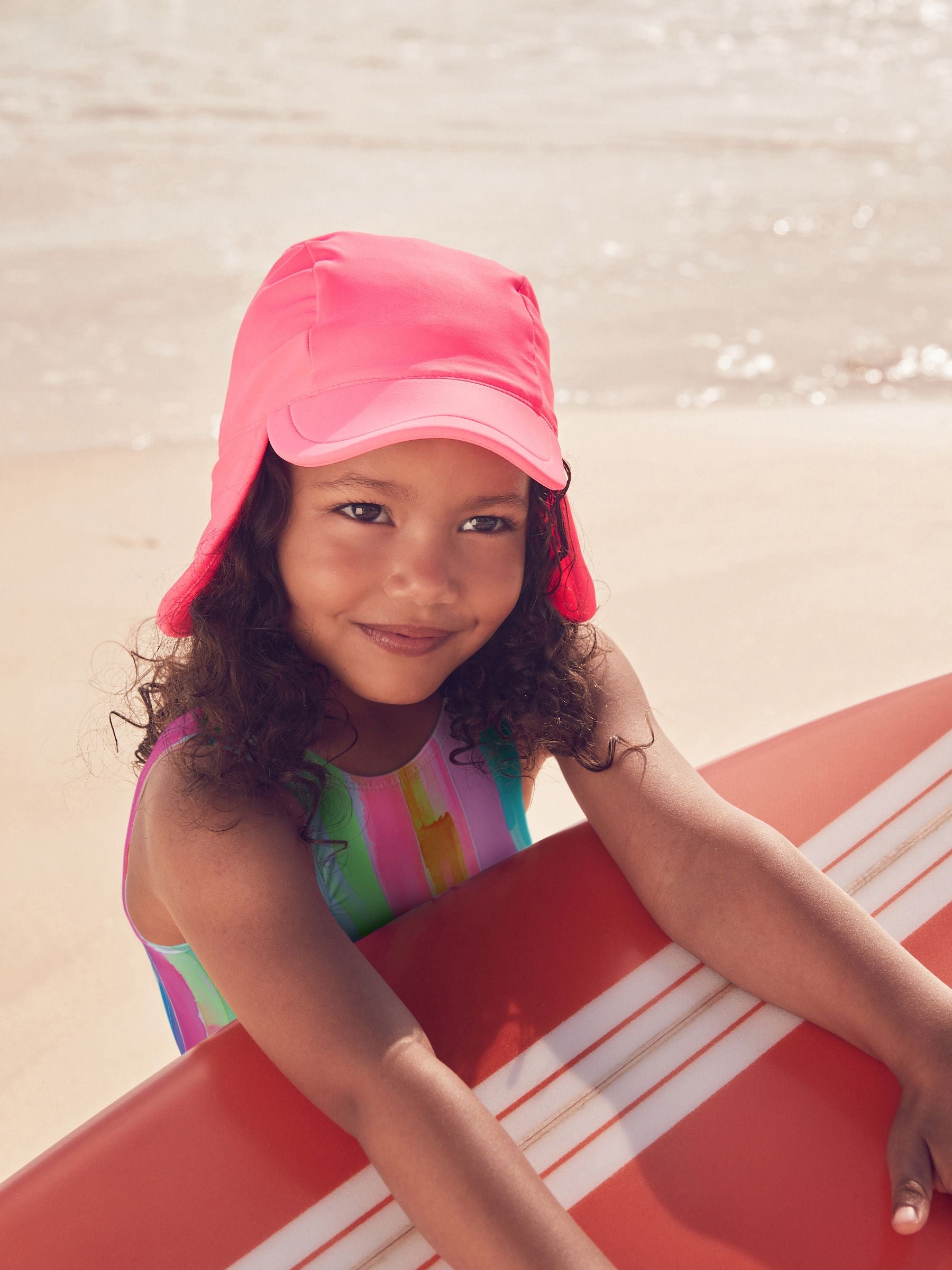 Bright pink legionnaire swim hat for kids, UK version