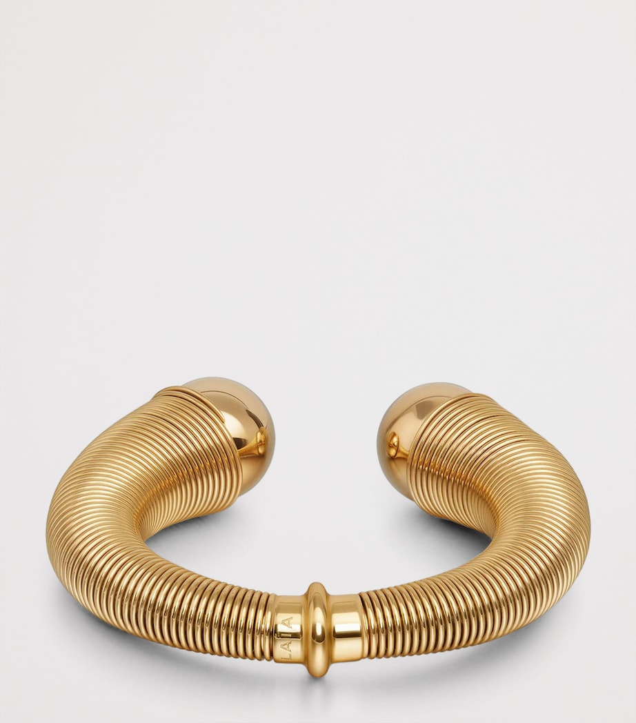 Alaïa spiral cuff gold-tone design with metal beads, UK version