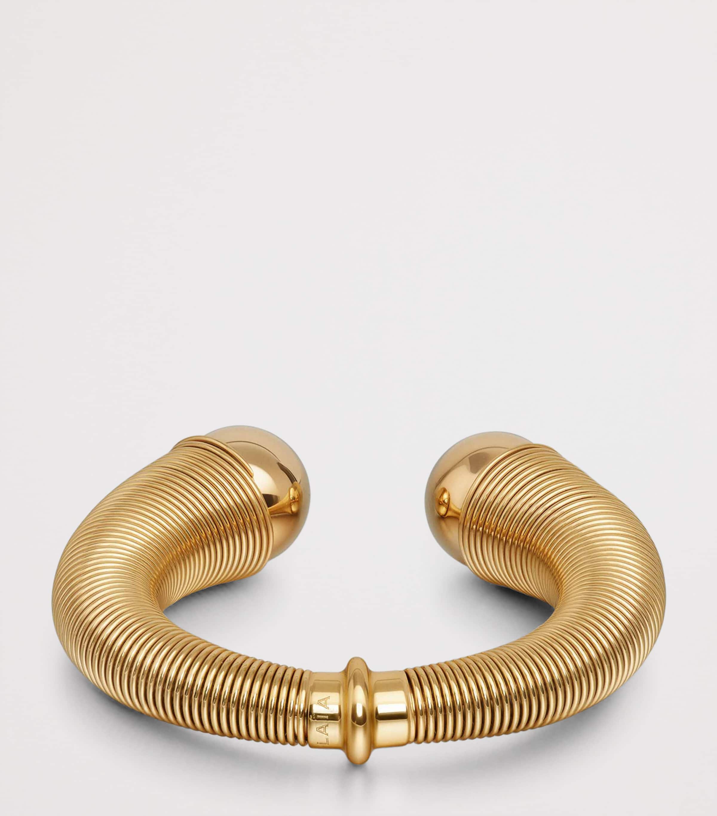 Alaïa spiral cuff gold-tone design with metal beads, UK version