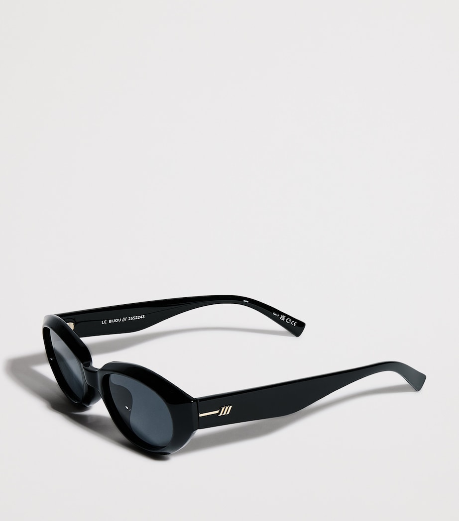 Le Specs Le Bijou ovale Sonnenbrille mit goldfarbenen Details, UK-Version