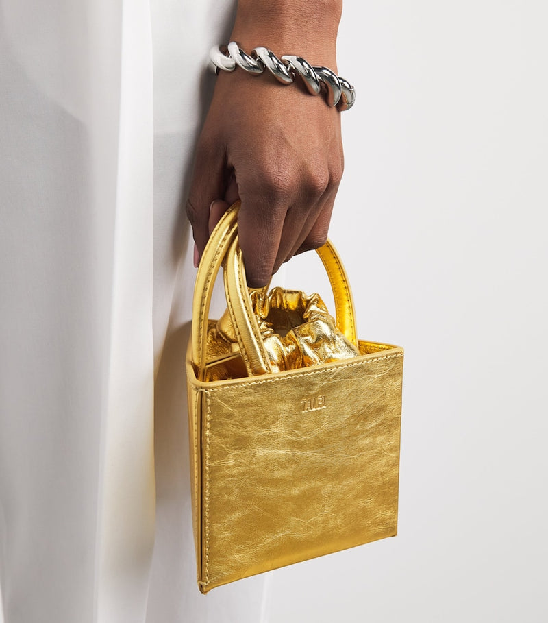 Talel Paris metallic leather triangle top-handle bag (British brand)