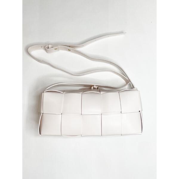 SVNX woven PU shoulder bag in cream, imported from the UK