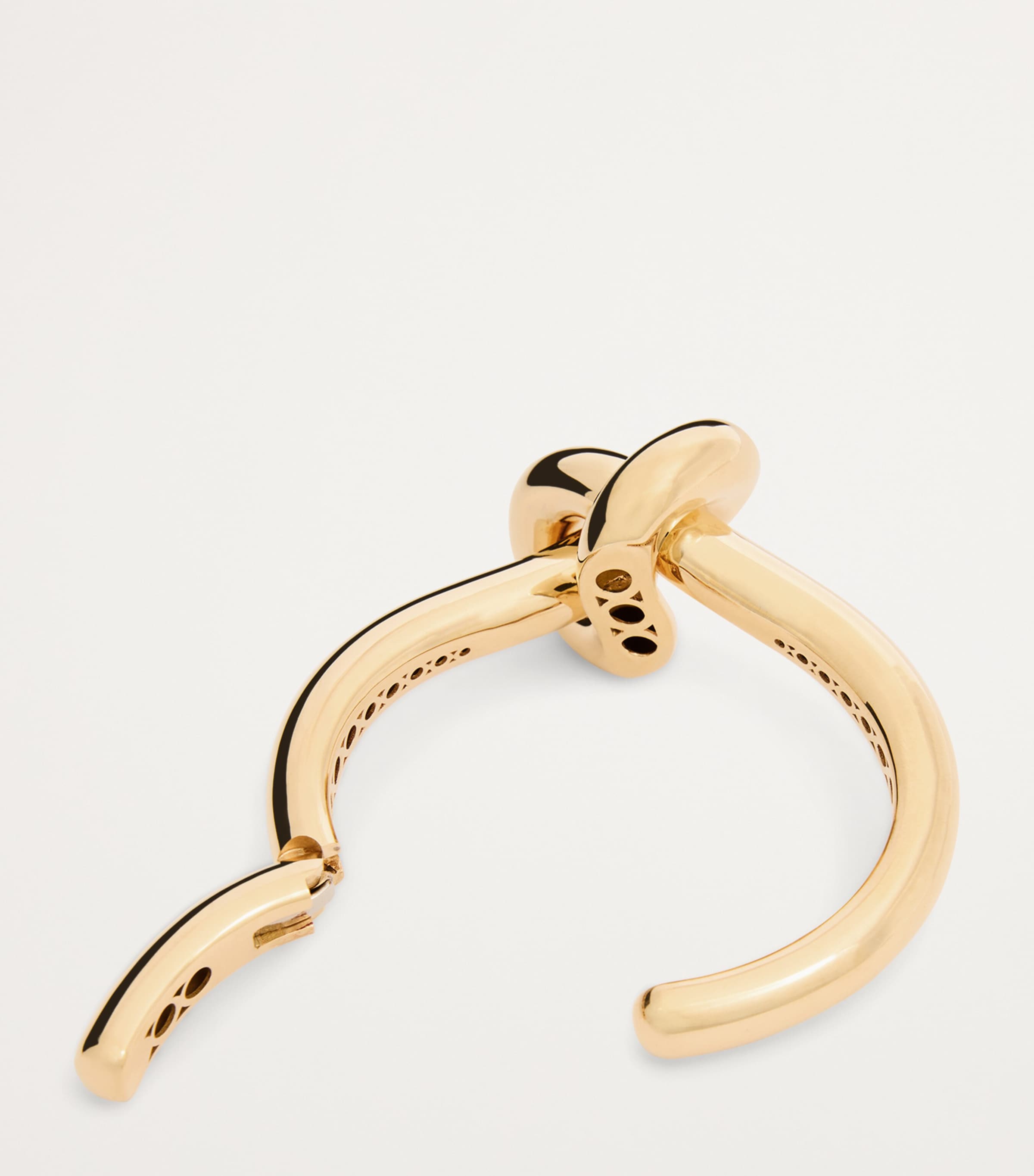 Engelbert yellow gold knot bangle with circular detailing - British product