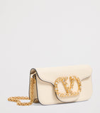 Valentino Garavani Small Embellished Locò shoulder bag, imported from the UK