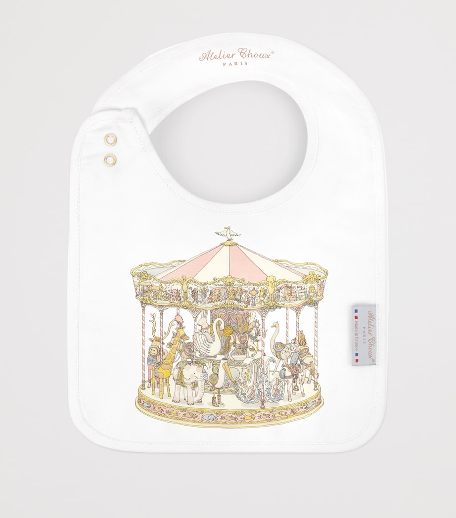Atelier Choux organic cotton carousel print bib, UK version