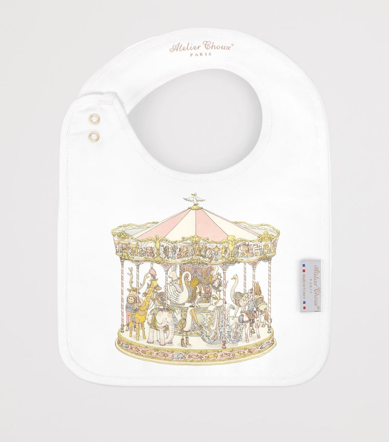Atelier Choux organic cotton carousel print bib, UK version