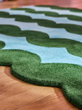 Eleanor Bowmer wool tufted rug green blue wavey, imported from the UK