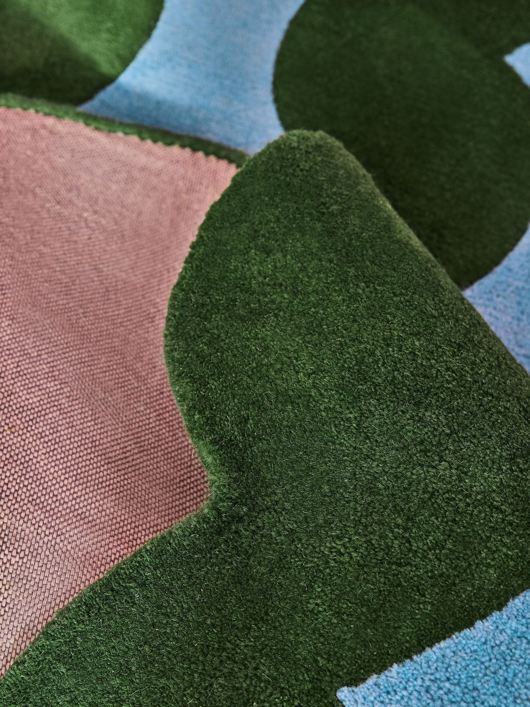 Eleanor Bowmer wool tufted rug green blue wavey, imported from the UK