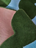 Eleanor Bowmer wool tufted rug green blue wavey, imported from the UK