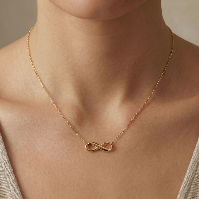Revere 9ct yellow gold infinity pendant necklace, imported from the UK