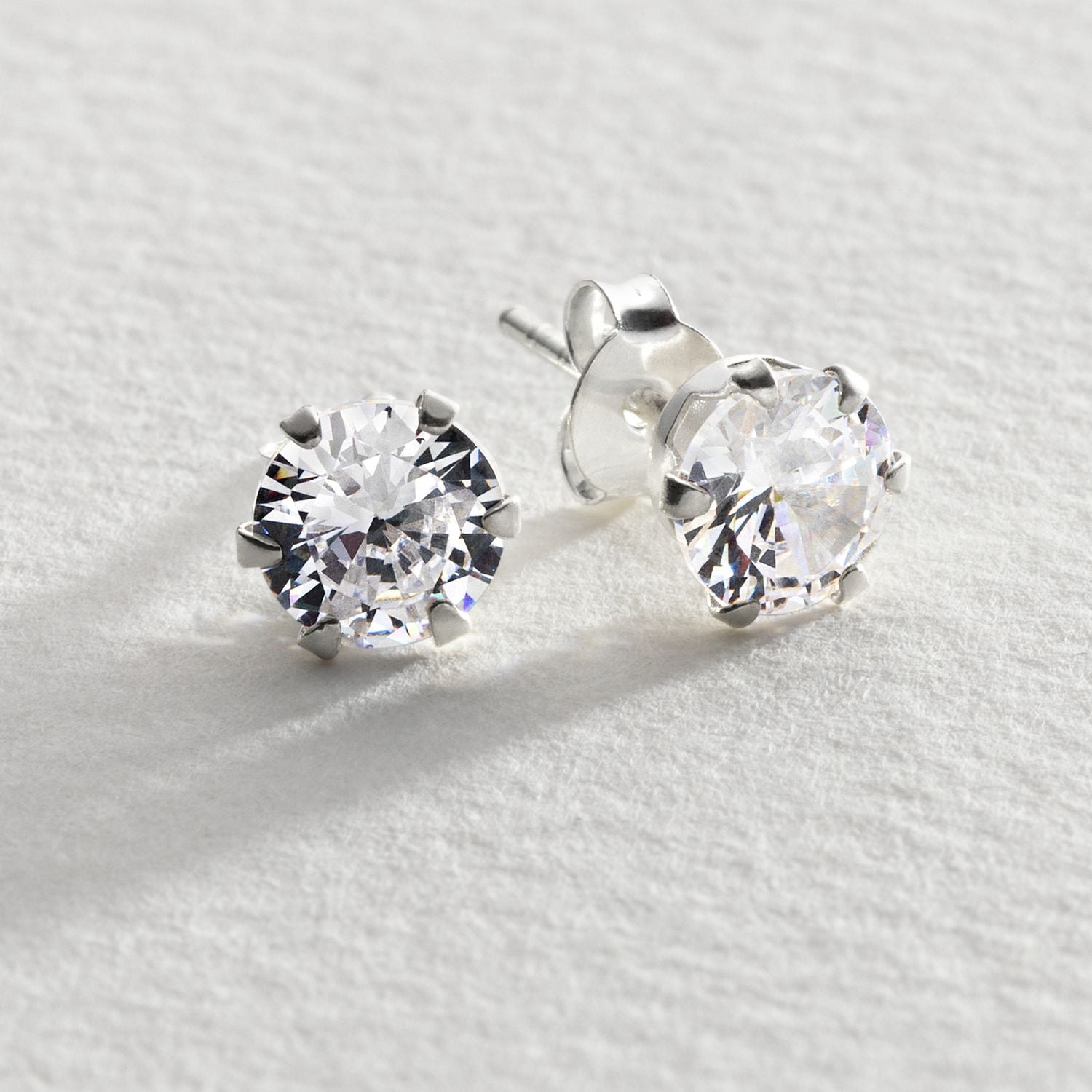 Revere cubic zirconia stud earrings in sterling silver, imported from the UK