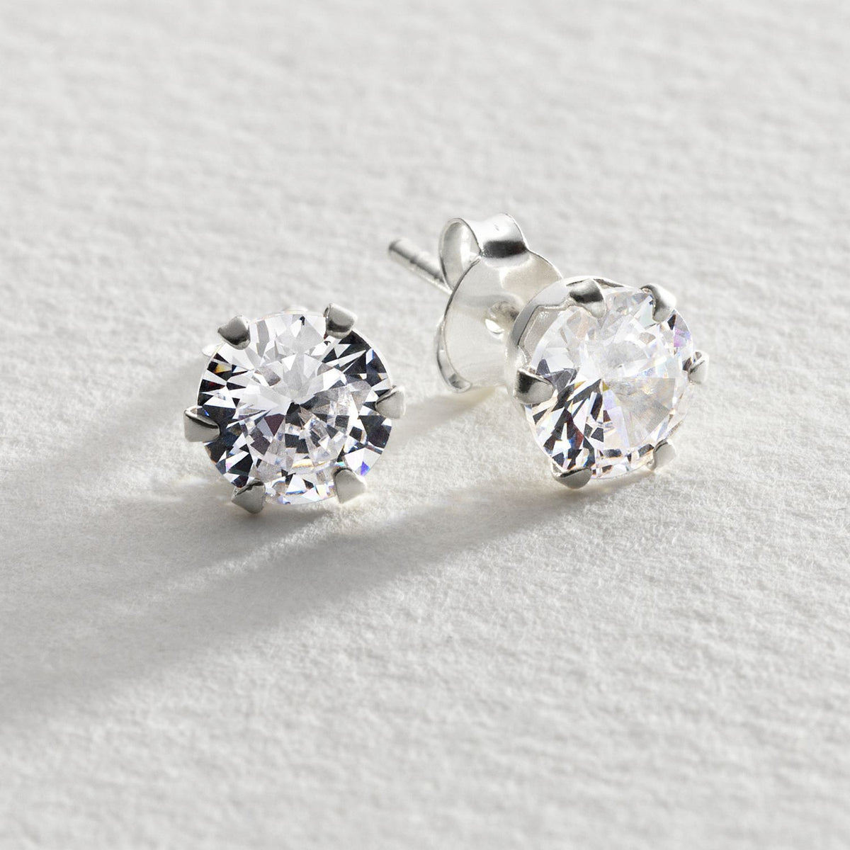 Revere cubic zirconia stud earrings in sterling silver, imported from the UK