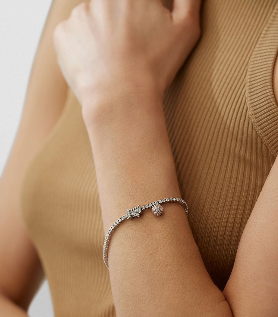 Boodles platinum diamond tennis bracelet with tennis ball charm, imported from the UK