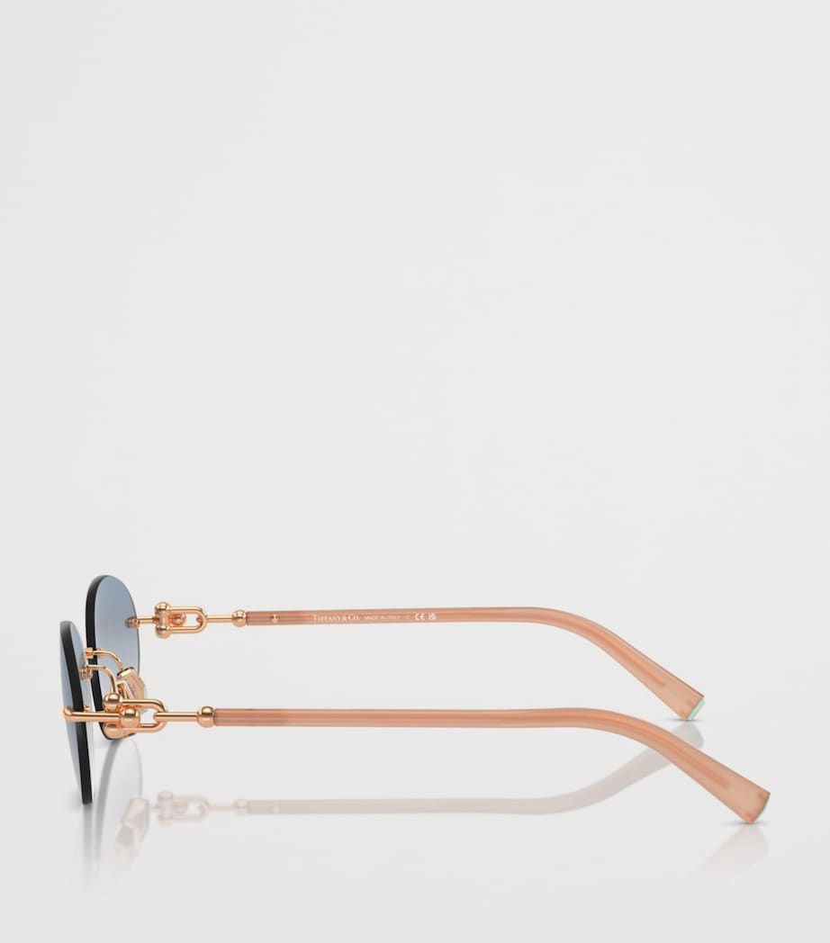 Tiffany & Co. rimless oval sunglasses with gold-tone temples, UK version
