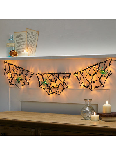 Lights4fun Schwarzes 90cm Spinnennetz batteriebetrieben