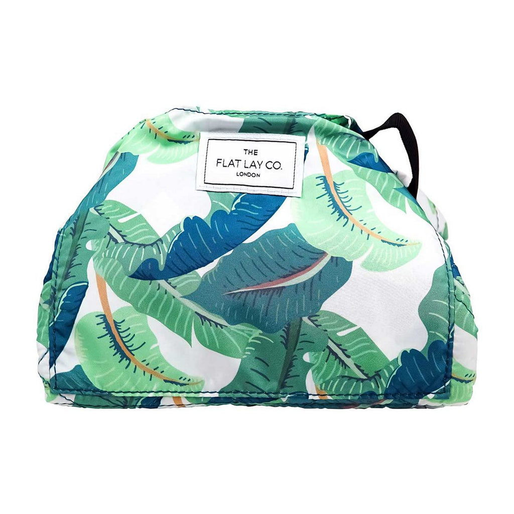 The Flat Lay Co. Open Flat Drawstring Makeup Bag in Tropical Leaves Print