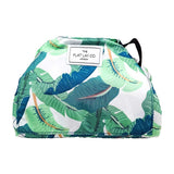 The Flat Lay Co. Open Flat Drawstring Makeup Bag in Tropical Leaves Print GOODS Boots   