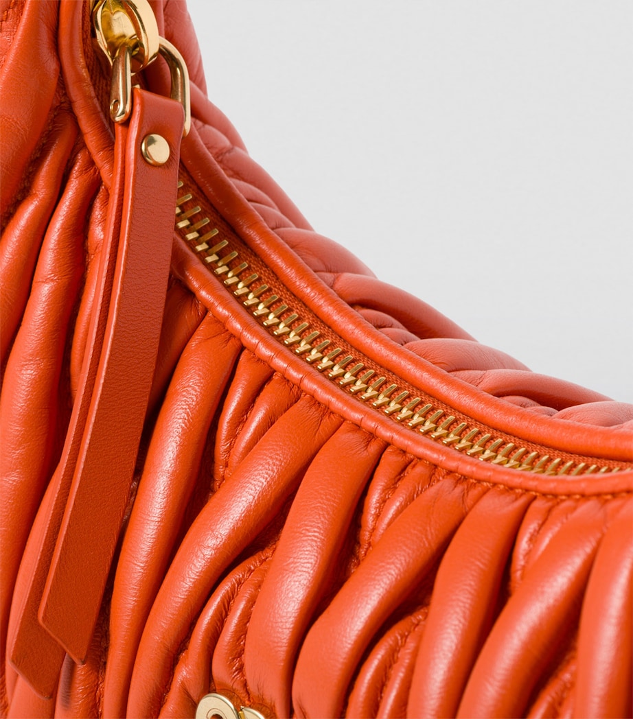 Miu Miu small matelassé leather Wander top-handle bag, UK version