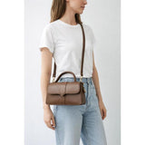 SVNX brown crossbody bag with hard top handle, UK version