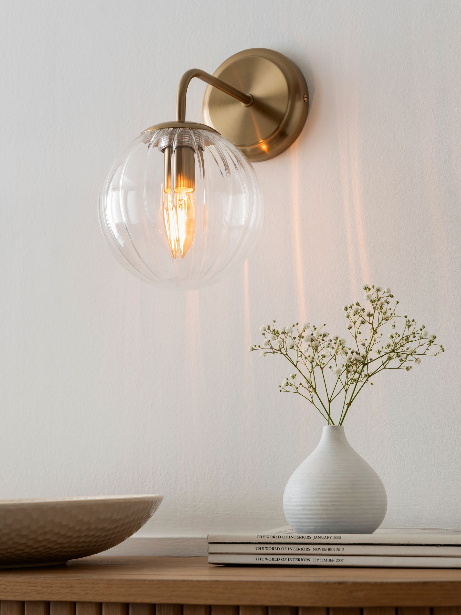 Brass Bourton wall light with swirl glass shade, imported from the UK