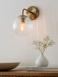 Brass Bourton wall light with swirl glass shade, imported from the UK