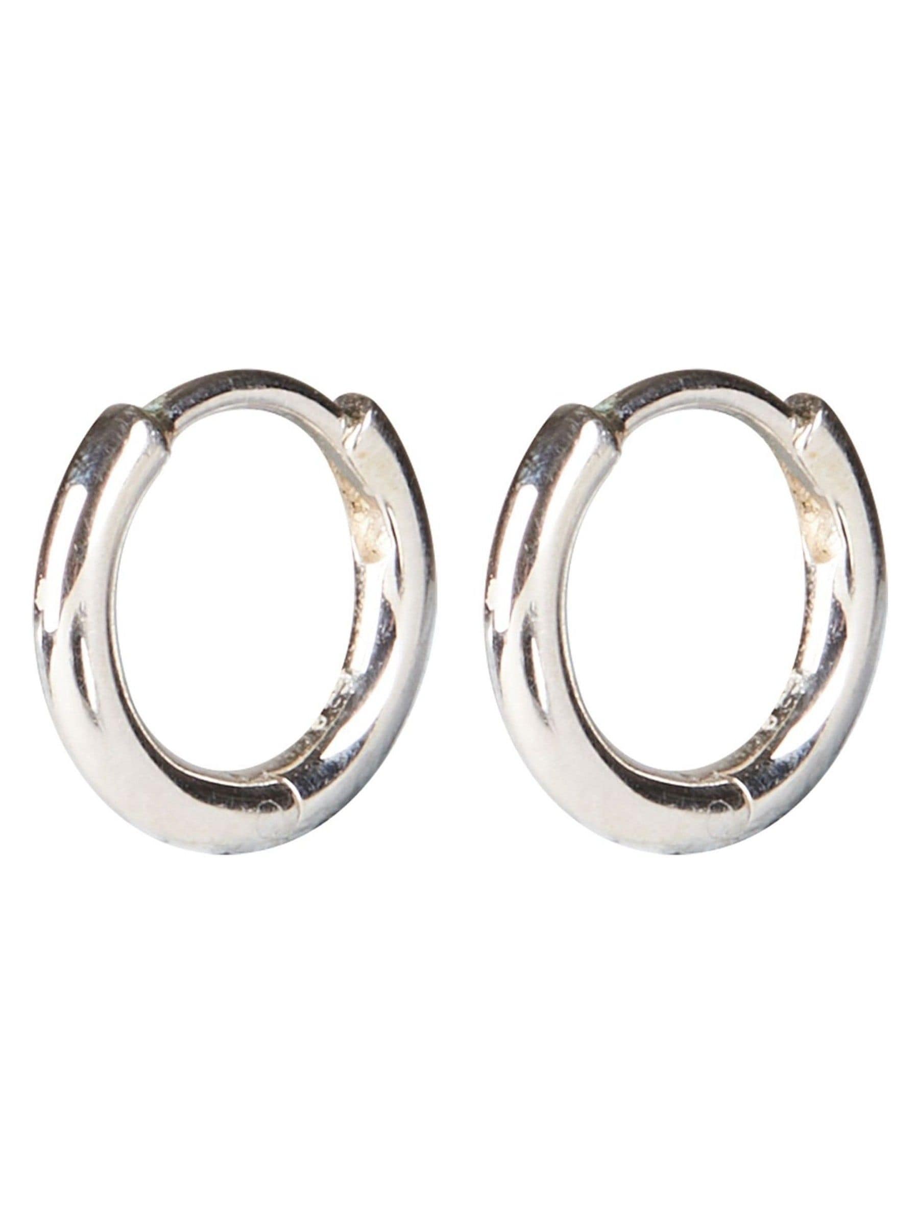 Oliver Bonas silver tone juniper mini huggie earrings, imported from the UK