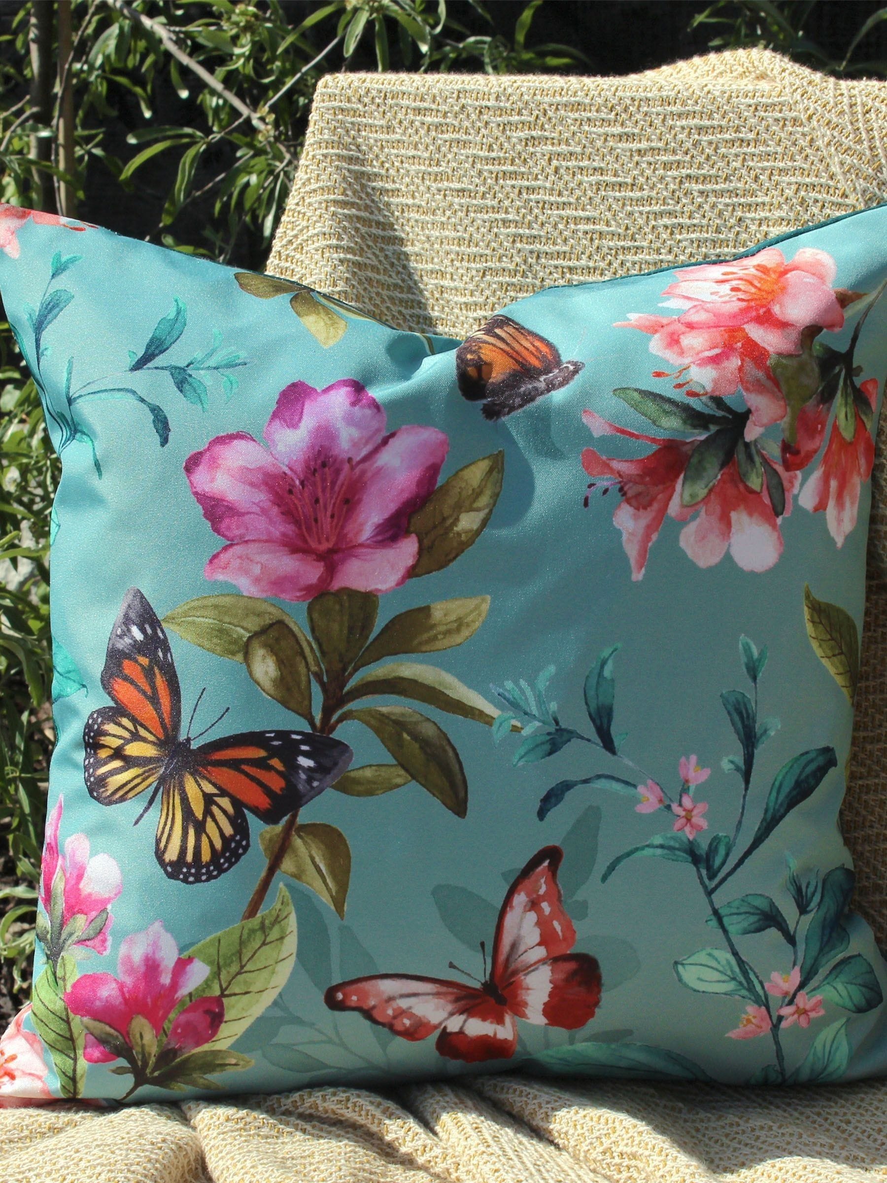 Evans Lichfield duck egg blue outdoor cushion with butterfly design, UK version