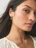 Mini gold tone heart hoop earrings, imported from the UK