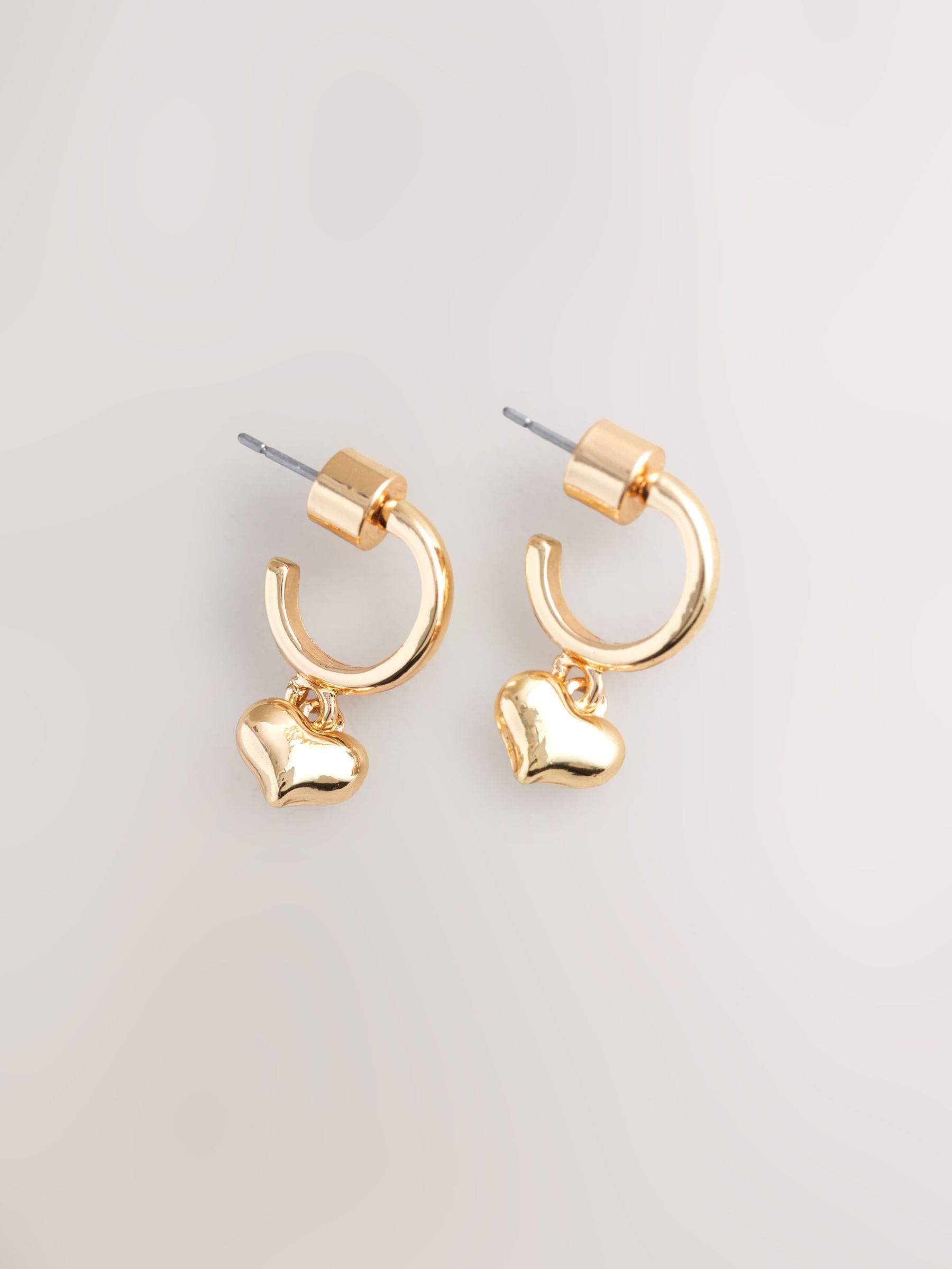Mini gold tone heart hoop earrings, imported from the UK