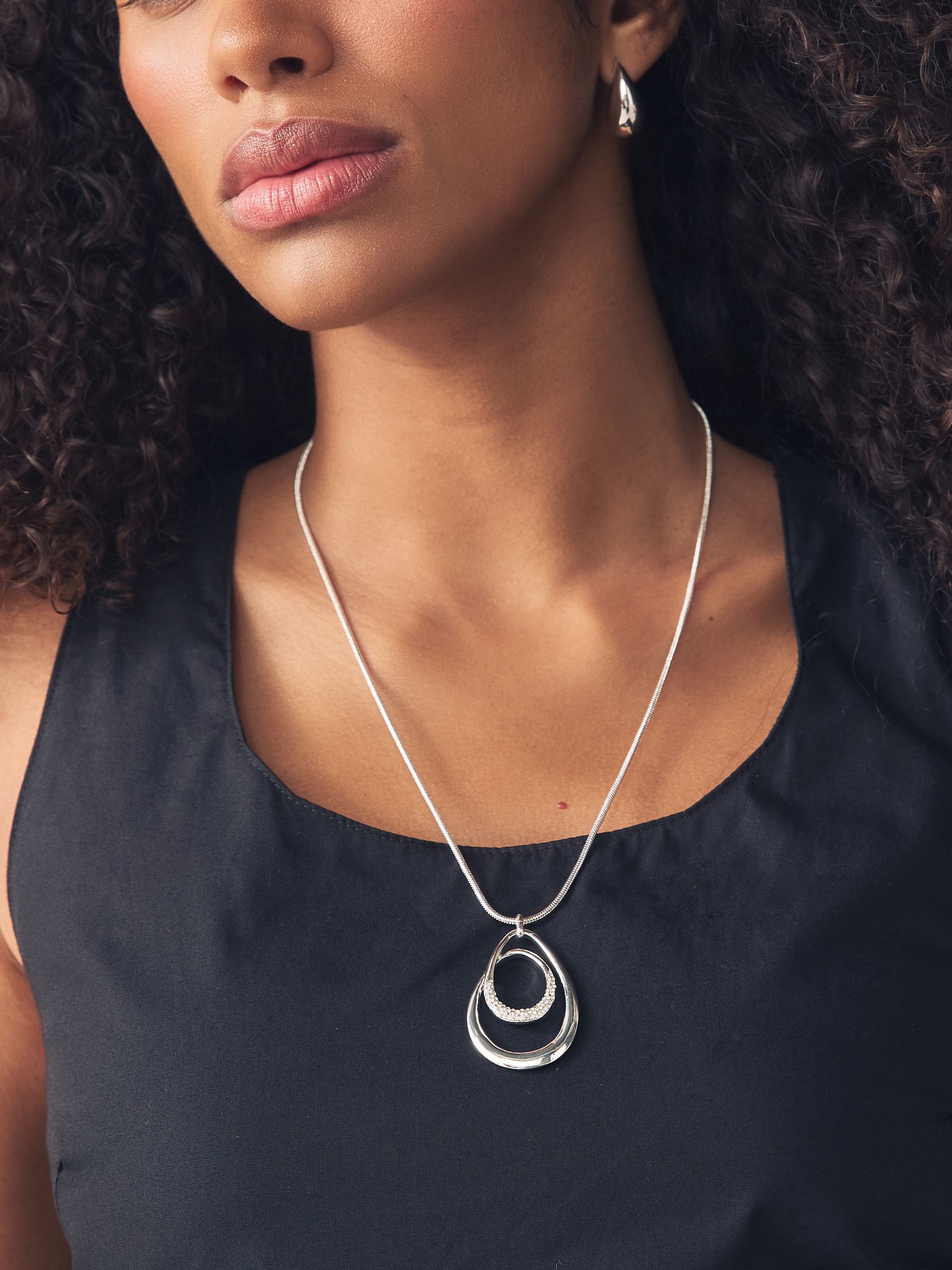 Silver tone necklace with swirl oval pave design - British product