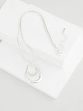 Silver tone necklace with swirl oval pave design - British product