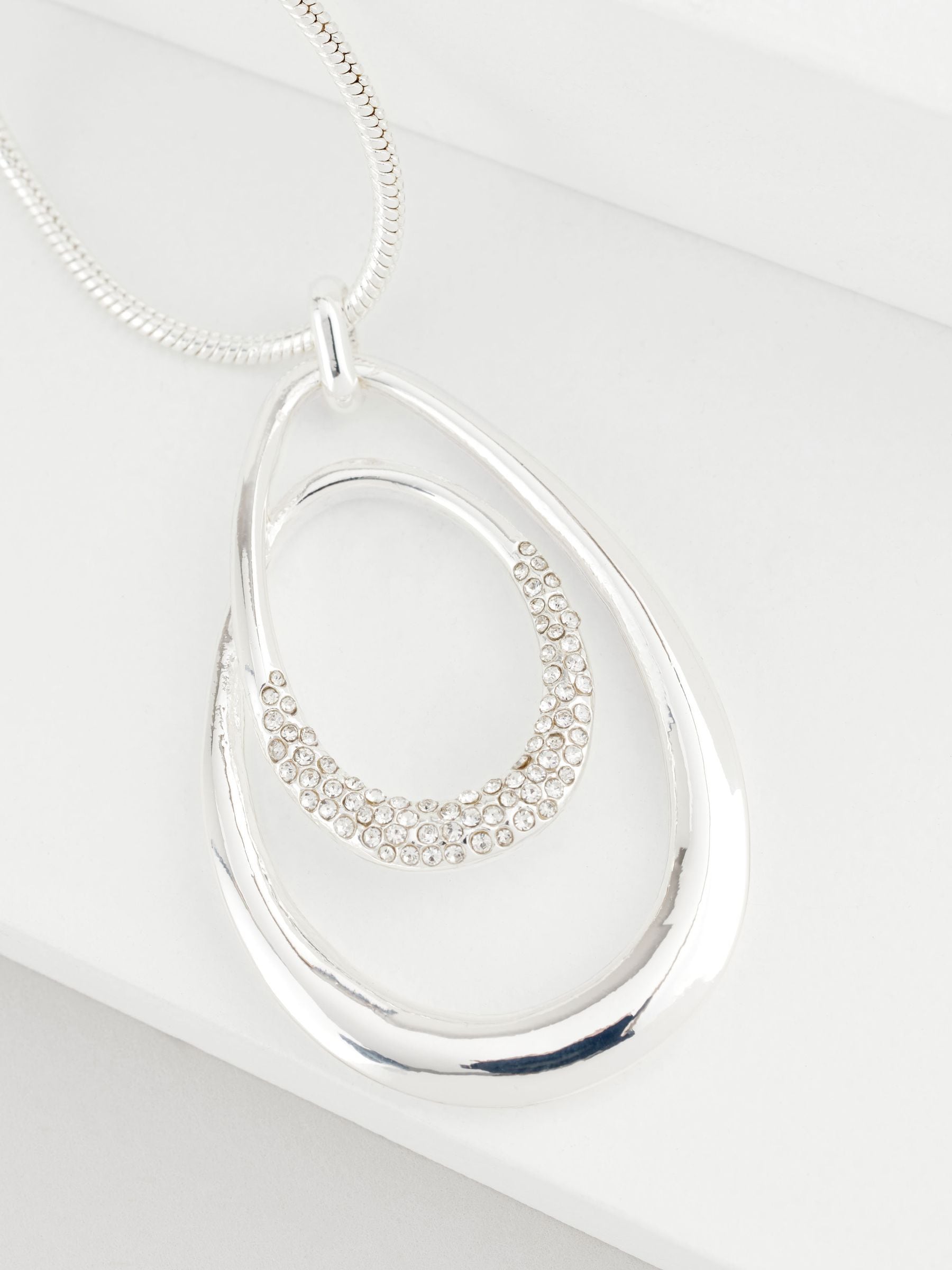 Silver tone necklace with swirl oval pave design - British product