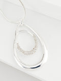 Silver tone necklace with swirl oval pave design - British product