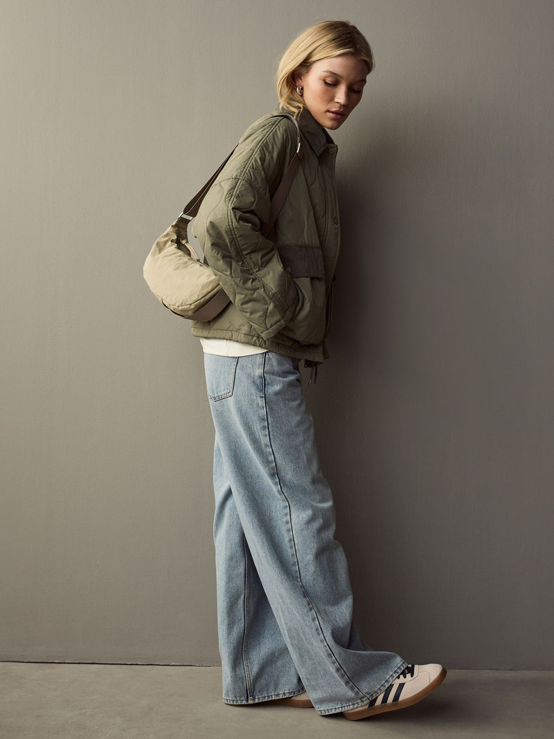 Stone sling bag with adjustable strap, imported from the UK