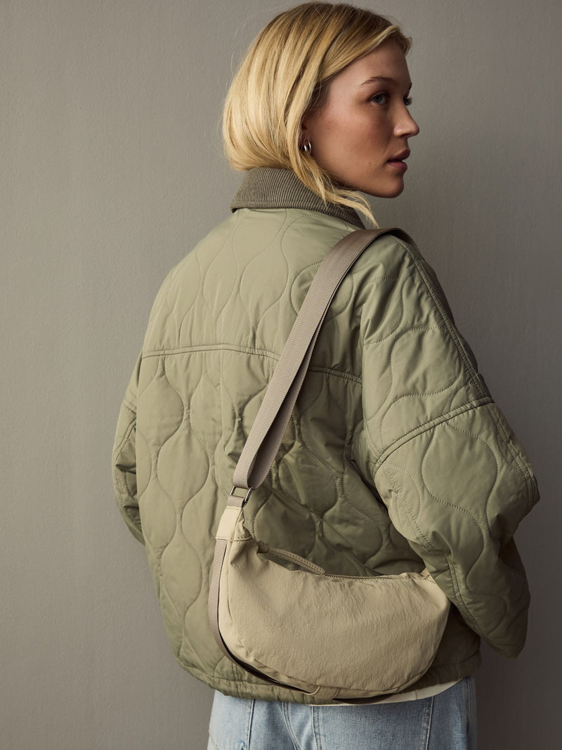 Stone sling bag with adjustable strap, imported from the UK