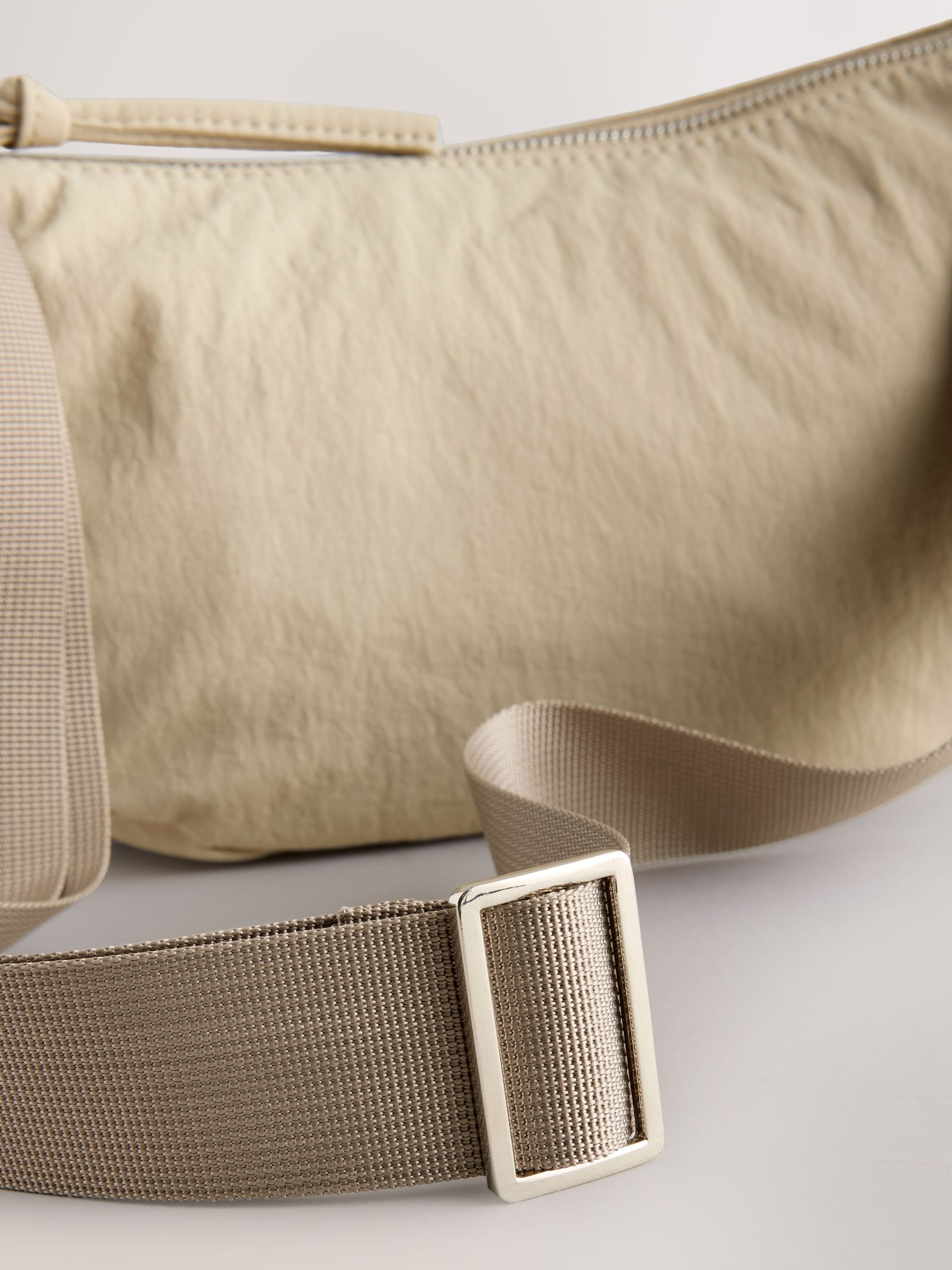 Stone sling bag with adjustable strap, imported from the UK