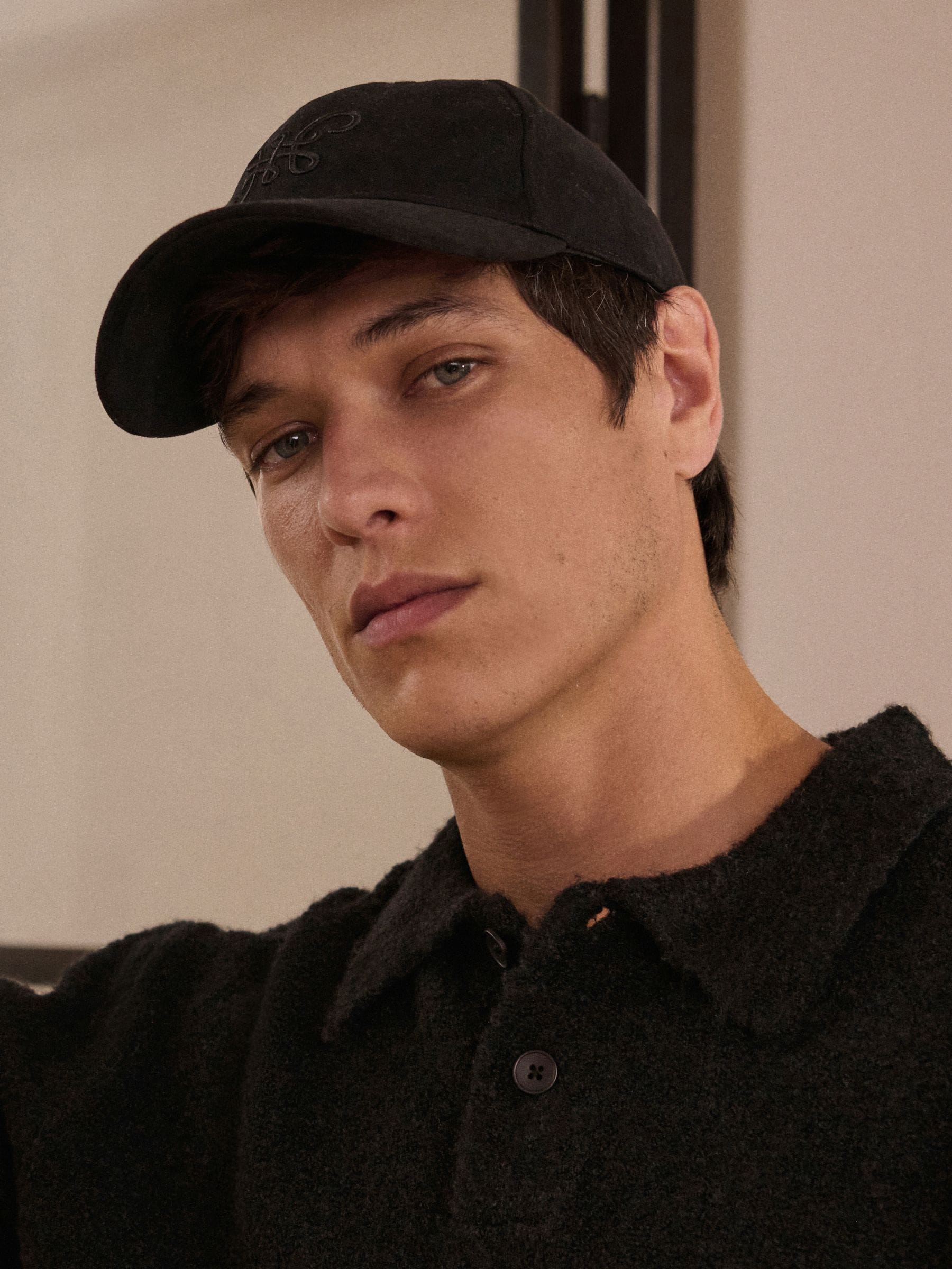 Black high build embroidery cap with curved brim (British brand)